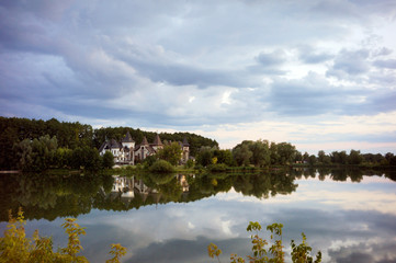 Impressive lake house. Reflected on water.