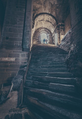 happy tourist visiting old abbey sacra san michele, turin, Italy