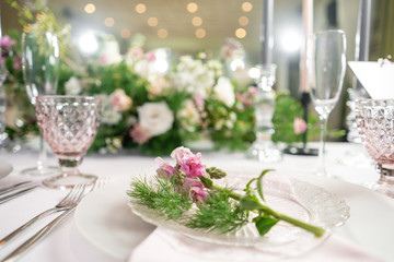Floral decoration for wedding ceremony romance dining. Wedding banquet , festive decor. Bouquet from spring and summer flowers. Table layout. Restaurant interior. Concept of service and catering.