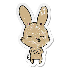 distressed sticker of a curious bunny cartoon