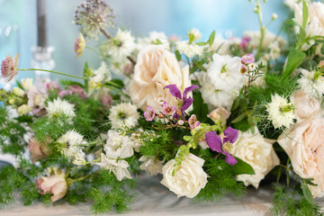 Floral decoration for wedding ceremony romance dining. Wedding banquet , festive decor. Bouquet from spring and summer flowers. Table layout. Restaurant interior. Concept of service and catering.