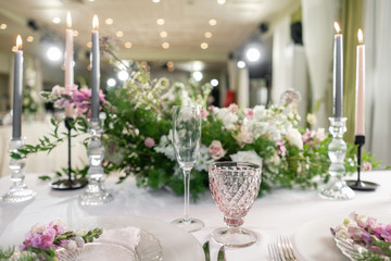 Floral decoration for wedding ceremony romance dining. Wedding banquet , festive decor. Bouquet from spring and summer flowers. Table layout. Restaurant interior. Concept of service and catering.