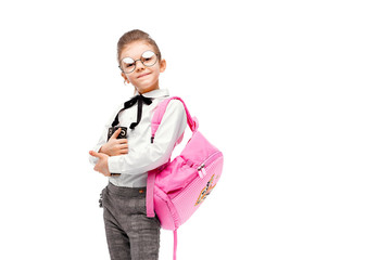 Back to school. Beautiful little girl dressed like a School girl - white shirt and gray pants,...