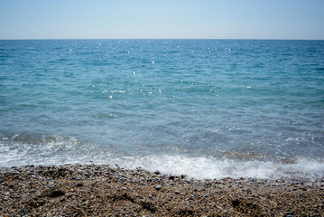 Fototapeta na wymiar Beach sea waves spray horizon Azur blue