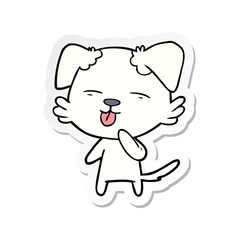 sticker of a cartoon dog sticking out tongue