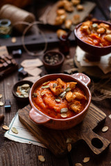 Two clay bowls with vegetable cream soup