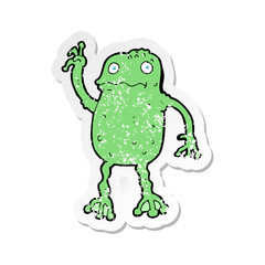 retro distressed sticker of a cartoon frog