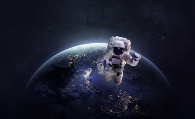 Obraz na płótnie Canvas к Astronaut in the outer space over the planet Earth. Abstract wallpaper. Spaceman. Elements of this image furnished by NASA