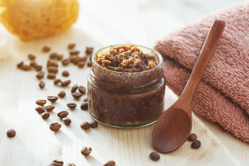 homemade natural scrub made of sugar, coffee, fruits and coconut oil, bath towel and sea sponge on...