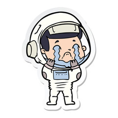 Obraz premium sticker of a cartoon crying astronaut