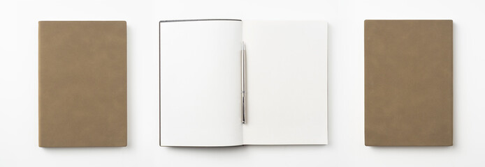 brown notebook and pen on white background