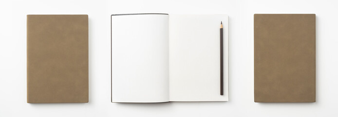 brown notebook and pen on white background