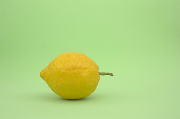 Profile of a lemon on green background