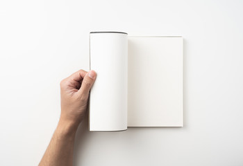 man hand hold brown notebook on white background