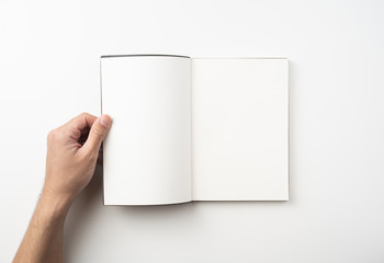 man hand hold brown notebook on white background