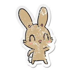 distressed sticker of a cute cartoon rabbit