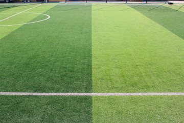 The white Line marking on the artificial green grass soccer field
