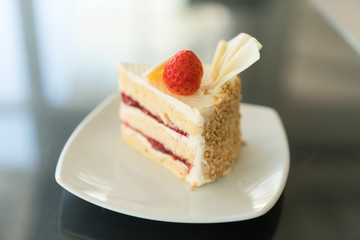 Strawberry cake on a white plate