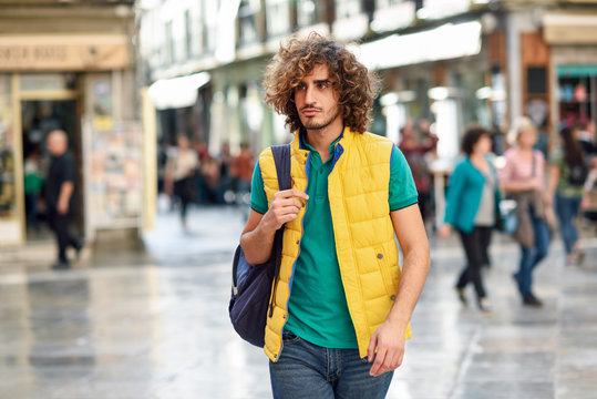 Spain, Granada, Portrait Of Young Tourist With Backpack Discovering The City