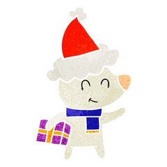 female polar bear with christmas present wearing santa hat