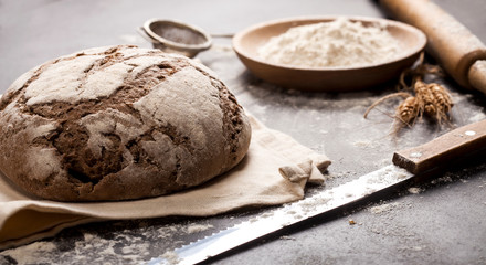 Bread and flour on a black table