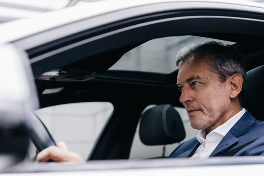 Businessman driving car