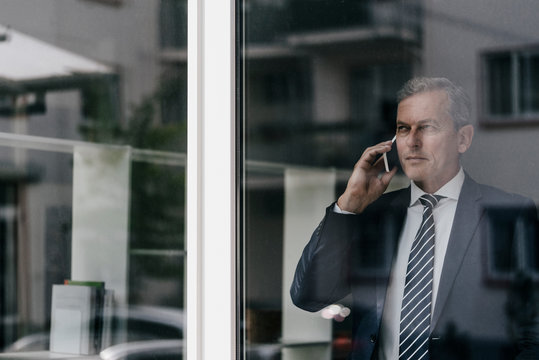 Mature businessman on cell phone