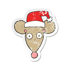 retro distressed sticker of a cartoon mouse in christmas hat