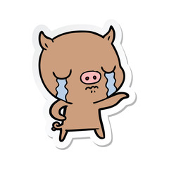 sticker of a cartoon pig crying pointing