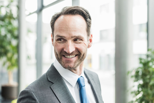 Portrait of smiling businessman with stubble