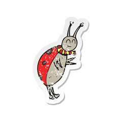 retro distressed sticker of a cartoon ladybug