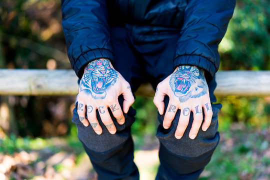 Man with tattooed hands, close-up