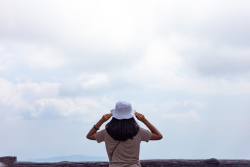 Traveler woman with holding hat joy relaxing looking view nature landscape