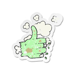 retro distressed sticker of a cartoon zombie hand