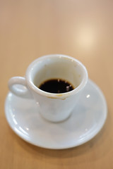 white coffee cup on wooden table