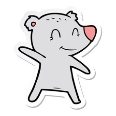 sticker of a smiling bear pointing