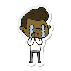 sticker of a cartoon man crying