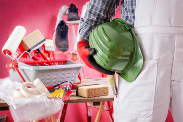 Professional house painter at work on the construction site. Building. © francescomou