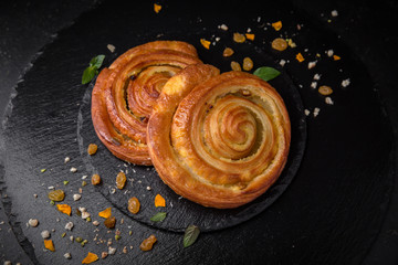 Sweet Soft Buns. Puff pastry bun with custard, raisins and chocolate Bakery