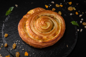 Sweet Soft Buns. Puff pastry bun with custard, raisins and chocolate Bakery
