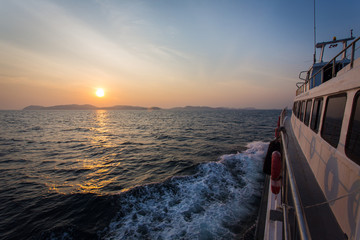 Ferry in the Ocean with Sunset