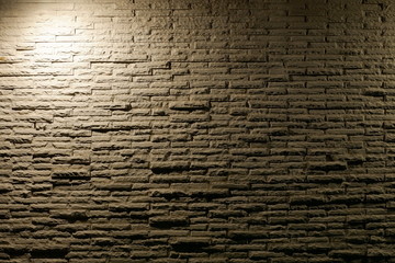 Fototapeta na wymiar white light with shadow on grunge brick wall