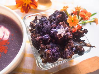 Closeup of Baked Purple Cauliflower and Soup