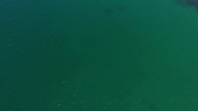Beautiful Drone 4k footage of beautiful rural beach landscape with Beautiful white sandy beach with turquoise sea water and palm trees at Kuala Abai, Kota Belud, Sabah, Borneo