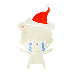 crying retro cartoon of a polarbear wearing santa hat