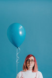 Pink haired girl with a balloon