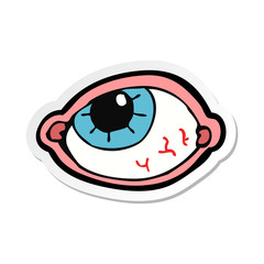 sticker of a cartoon spooky eye