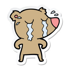 sticker of a cartoon crying bear