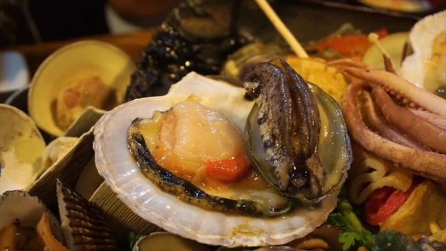 Footage close-up fresh abalone are moving