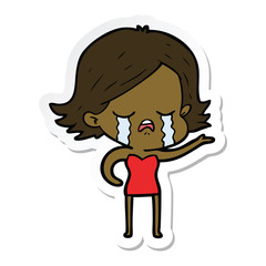 sticker of a cartoon girl crying